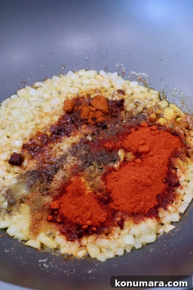 Paneer Makhani: Creamy Indian Butter Paneer Recipe 5 diced onions in large skillet with spices