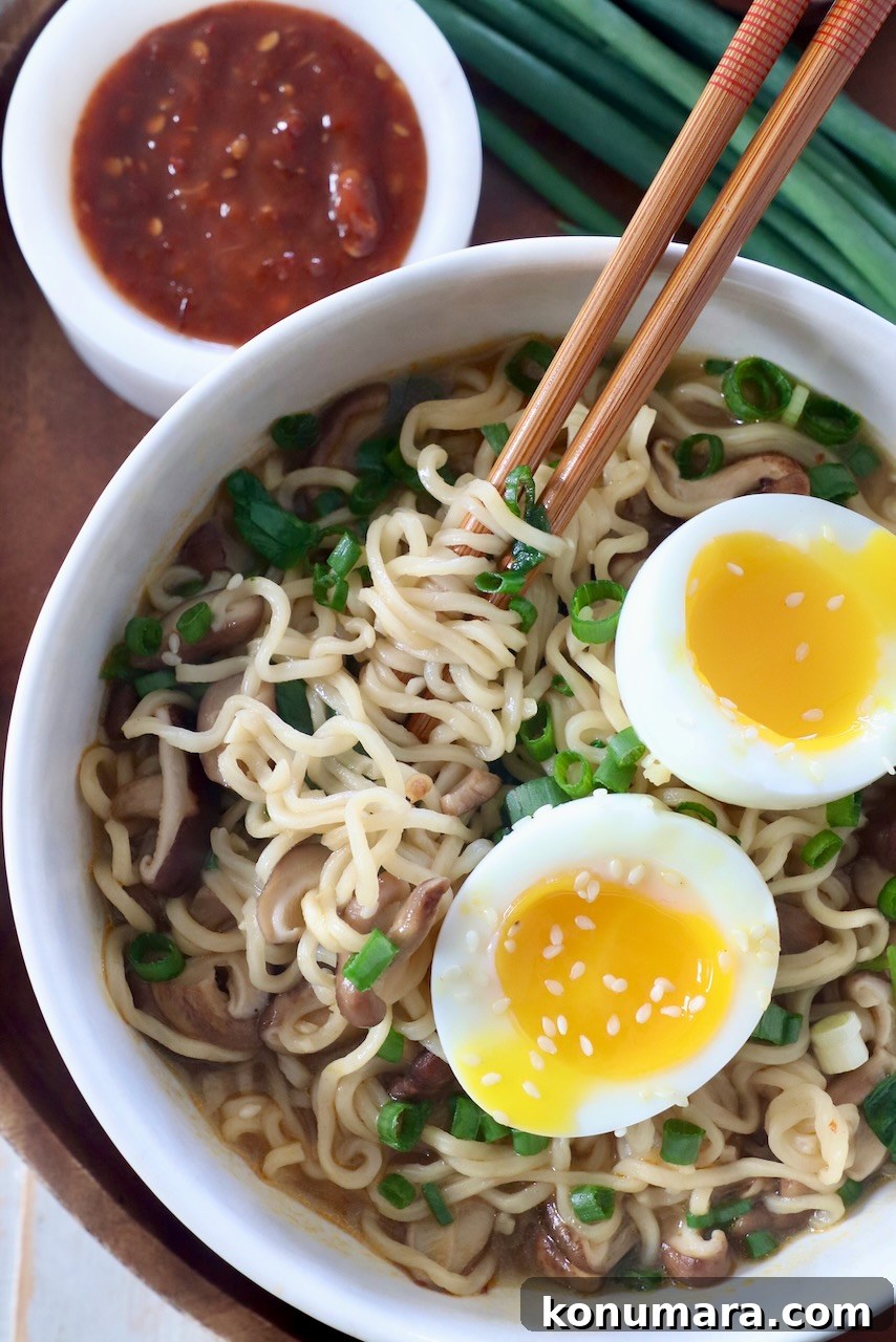 Vegetarian Ramen Recipe: Miso Umami Broth with Vegetables 6 cooked ramen noodle soup in bowl with chopsticks and soft boiled egg