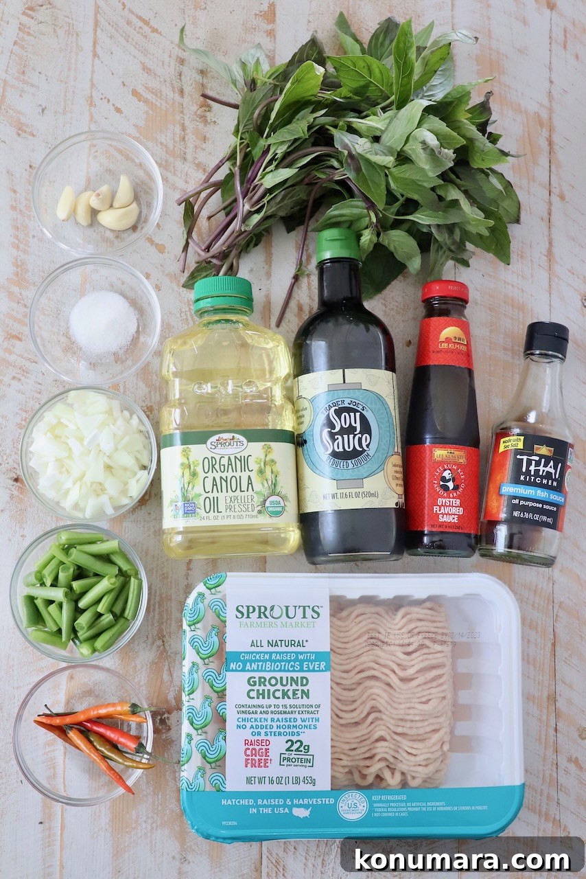 Spicy Thai Basil Chicken (Pad Krapow) Recipe 3 ingredients for thai basil chicken on white wood board