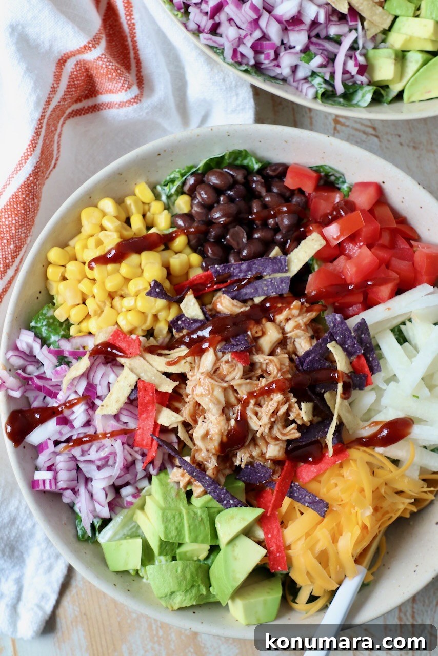 bbq chicken salad in bowl with fork