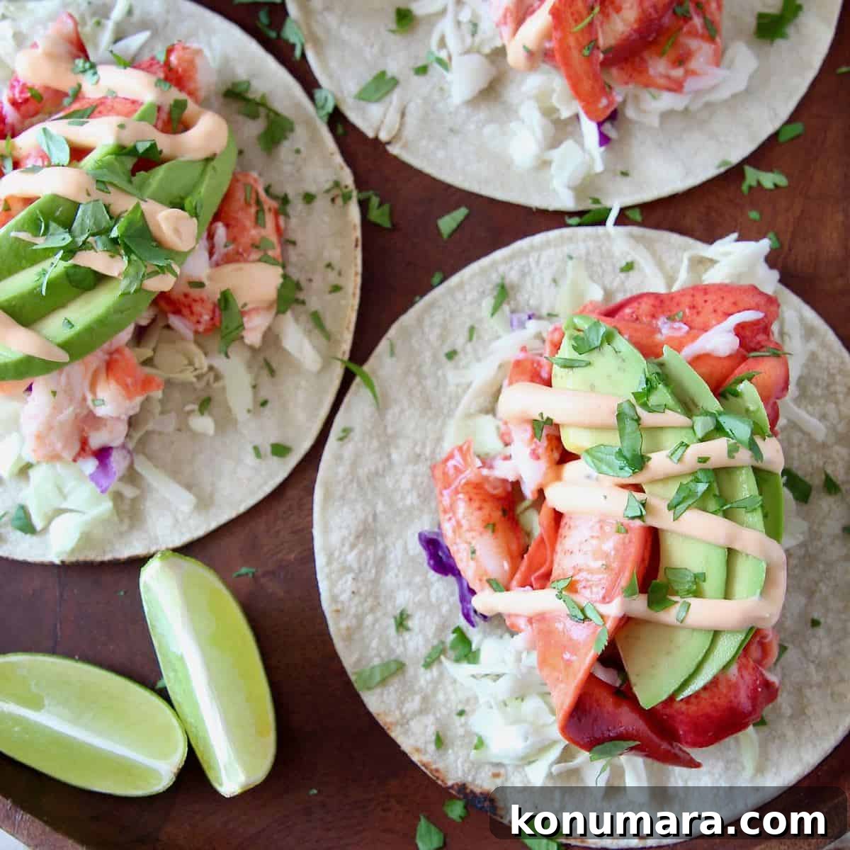 Overhead image of lobster tacos topped with remoulade sauce
