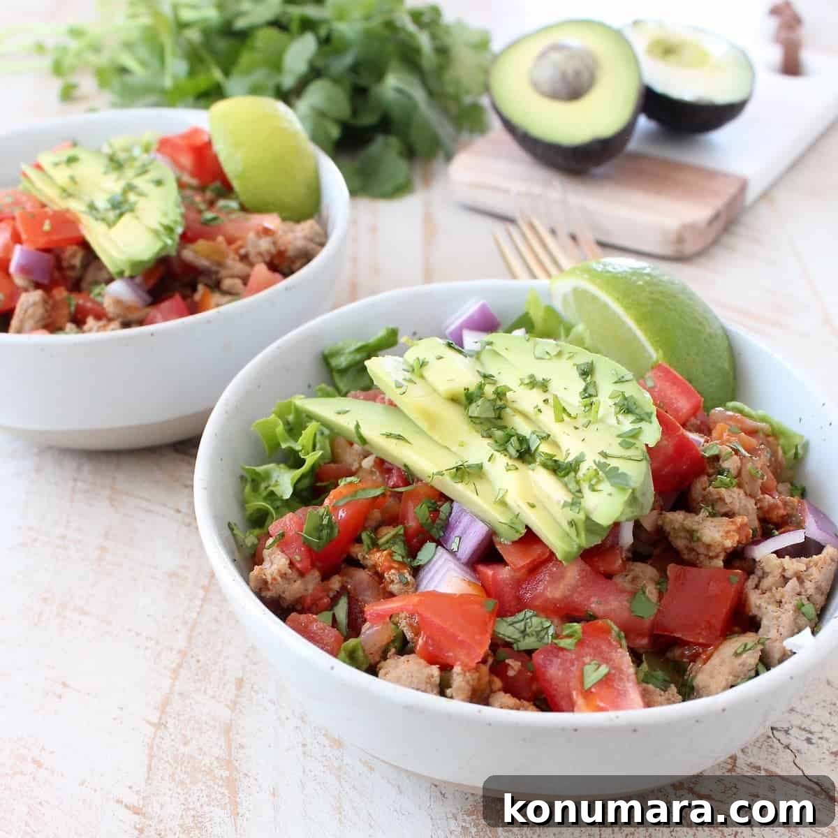 Taco seasoned ground turkey cooked with peppers, onions and tomatoes, tops this gluten free, dairy free, Whole30 taco salad recipe, made in just 20 minutes!