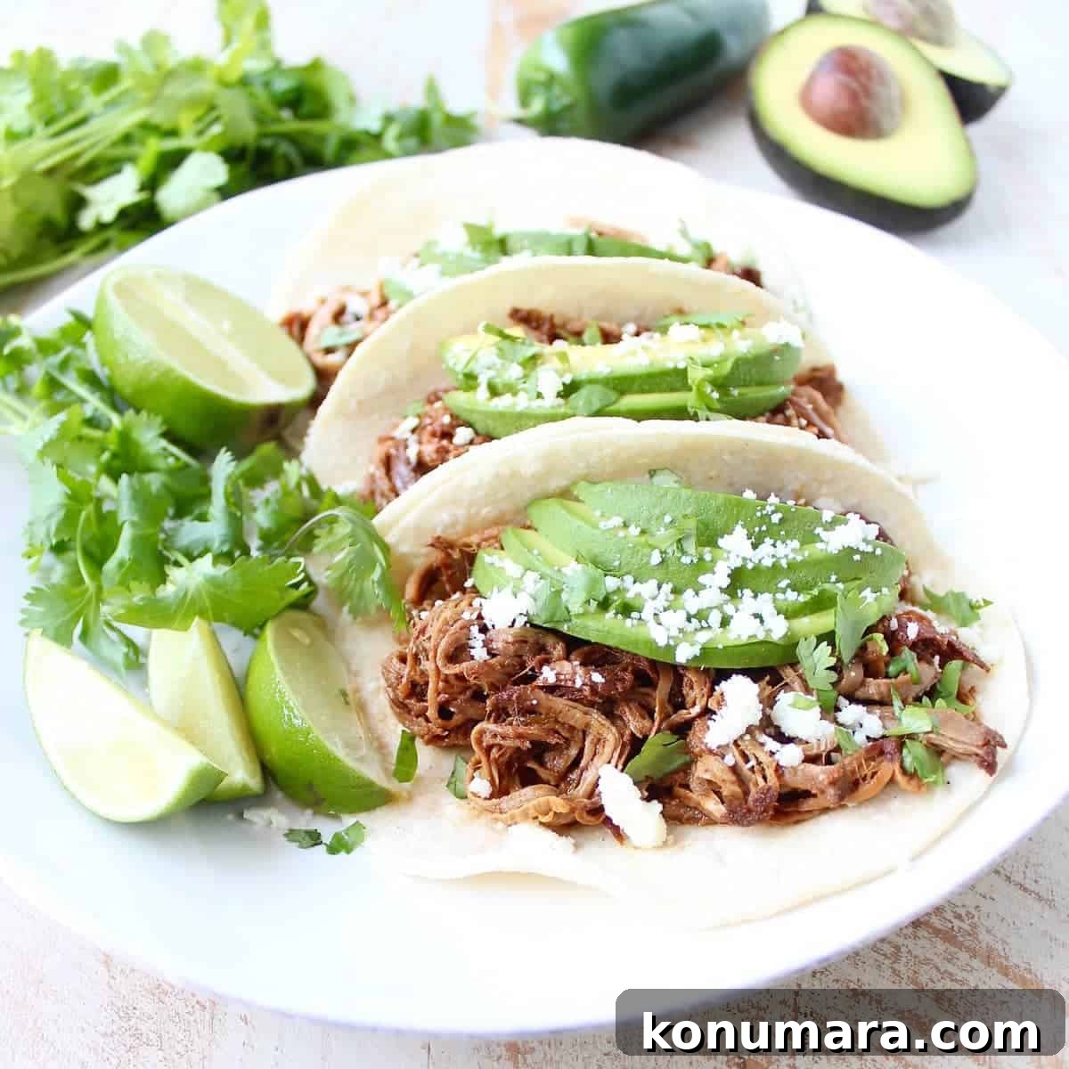 Slow Cooker Pulled Pork Tenderloin Chipotle Honey Tacos are a delicious and easy meal, perfect for weeknight dinners, game day or Taco Tuesday!