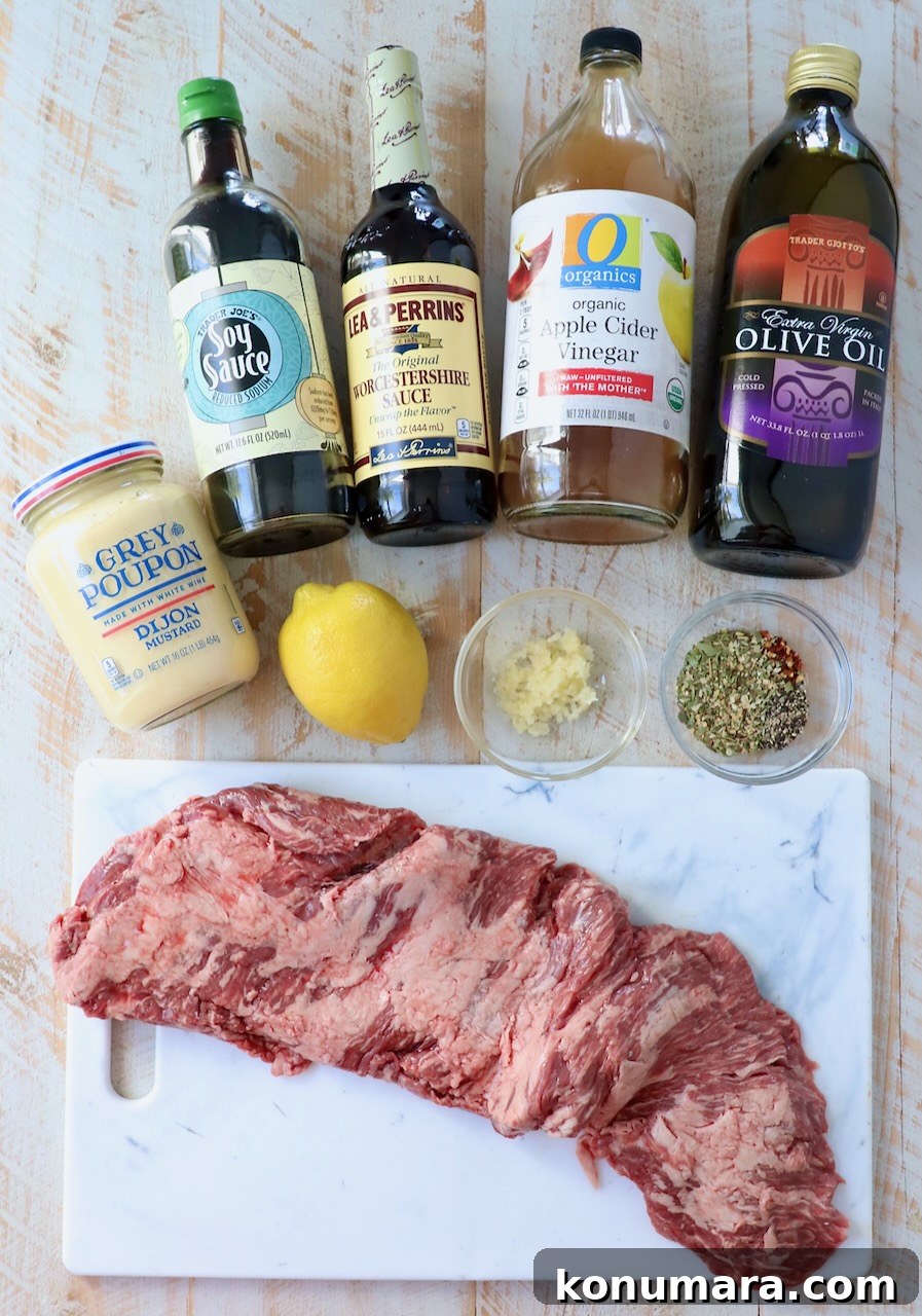 ingredients for marinated skirt steak on white wood board