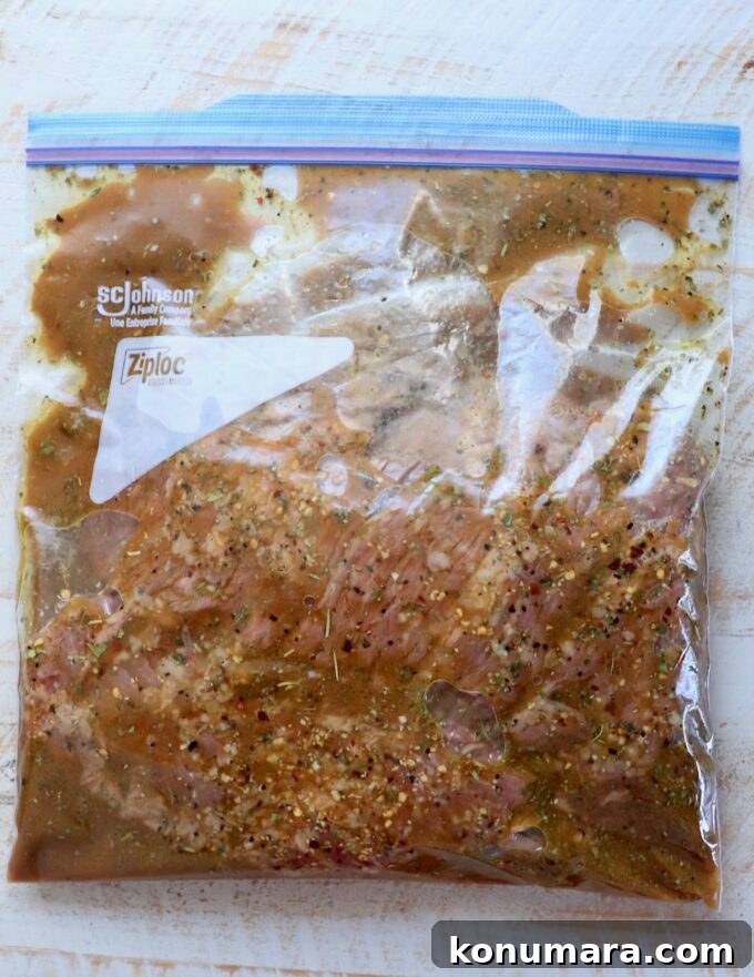 skirt steak in marinade in large zipper bag