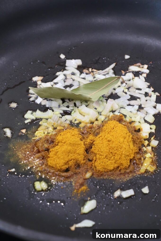 curry powder, diced shallots and bay leaf in a skillet
