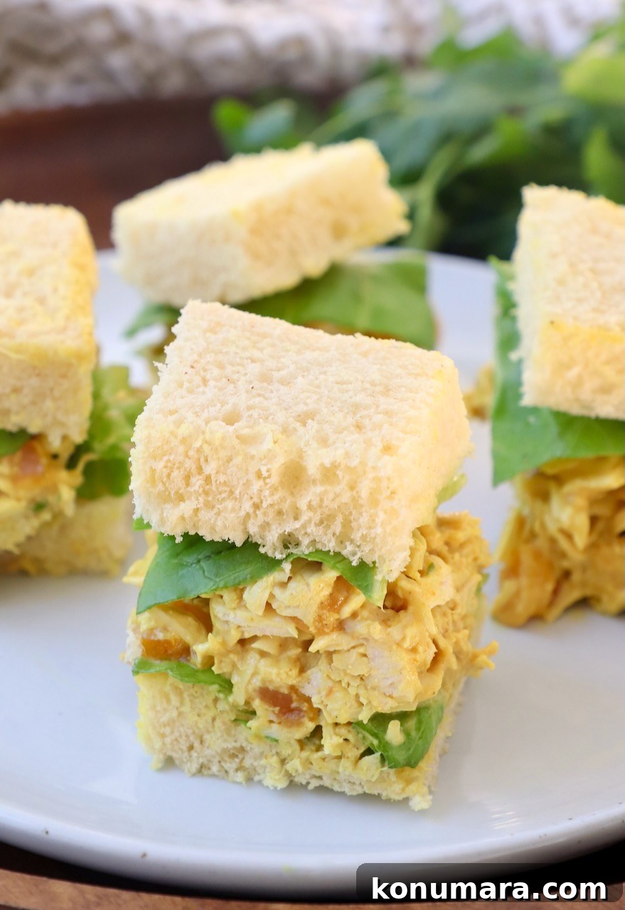 chicken salad tea sandwiches on a white plate