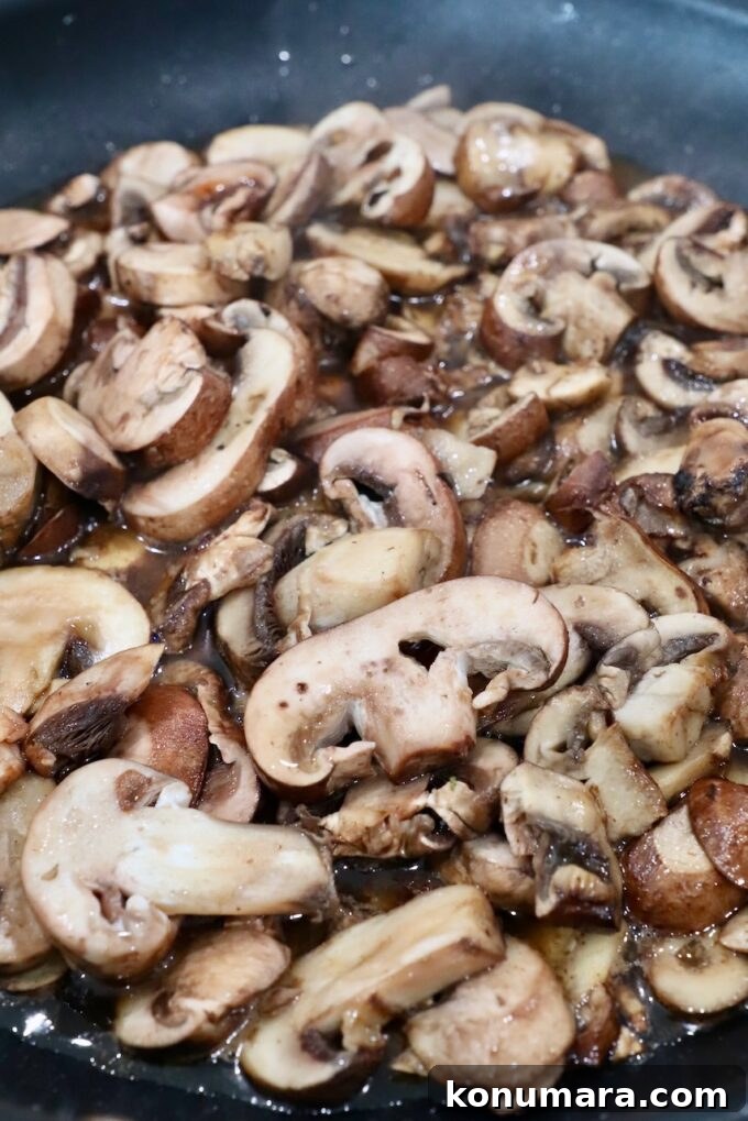 Sliced mushrooms in skillet