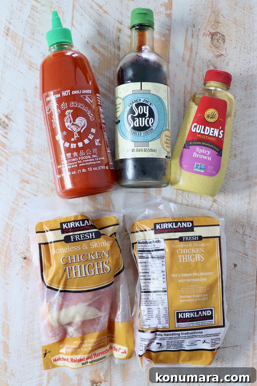 ingredients for chicken thigh marinade on white wood board