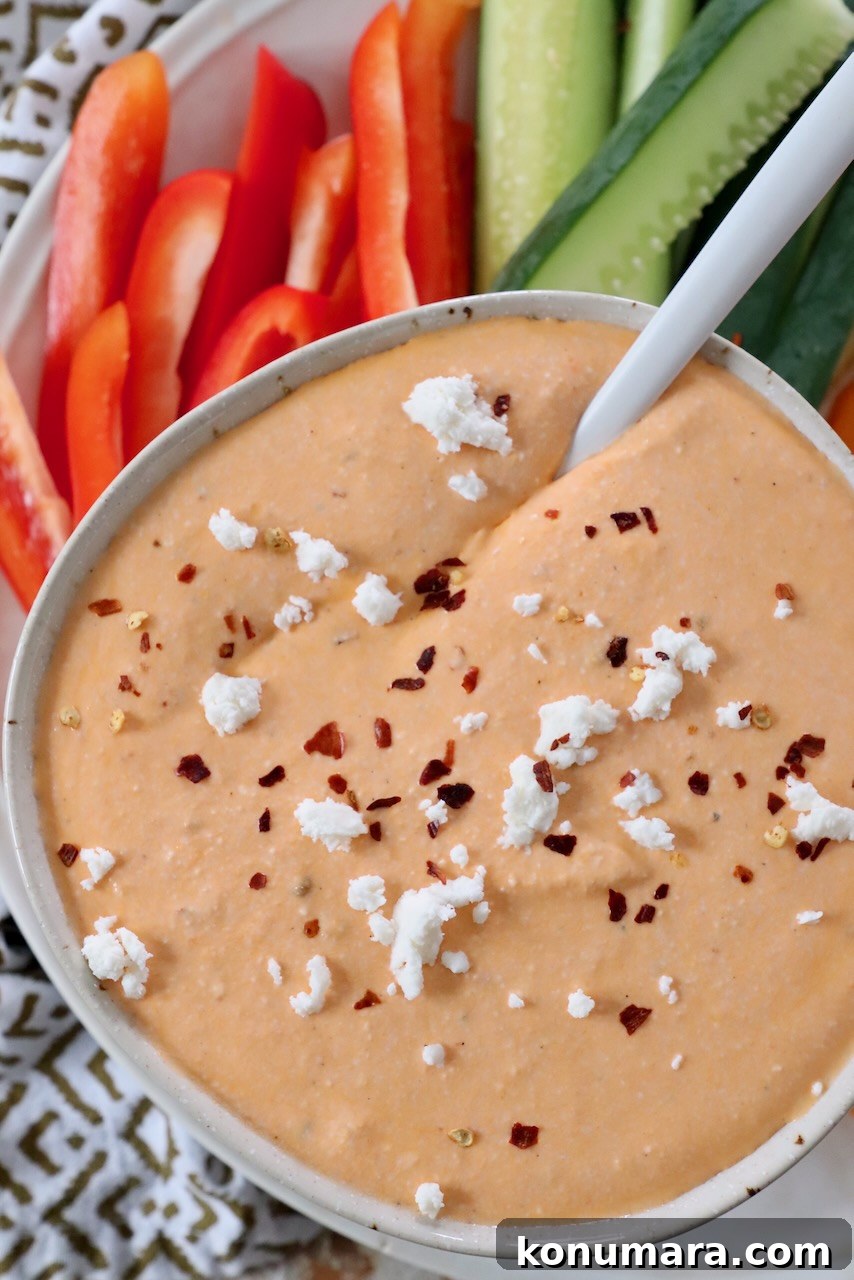 Spicy Whipped Feta Dip with Chili Oil and Herbs 2 spicy whipped feta dip in bowl with spoon