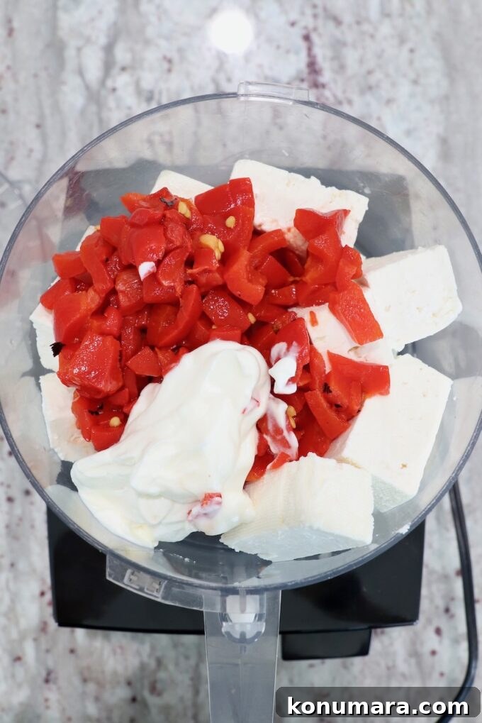 Spicy Whipped Feta Dip with Chili Oil and Herbs 4 feta cheese, greek yogurt and roasted red peppers in food processor