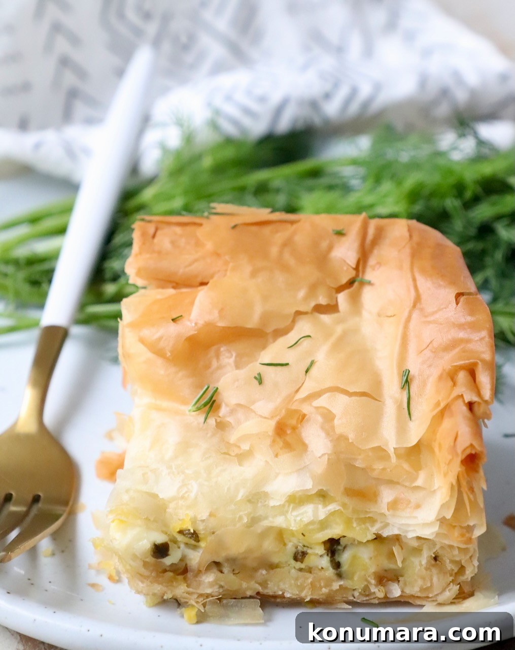 piece of zucchini pie on plate with fork