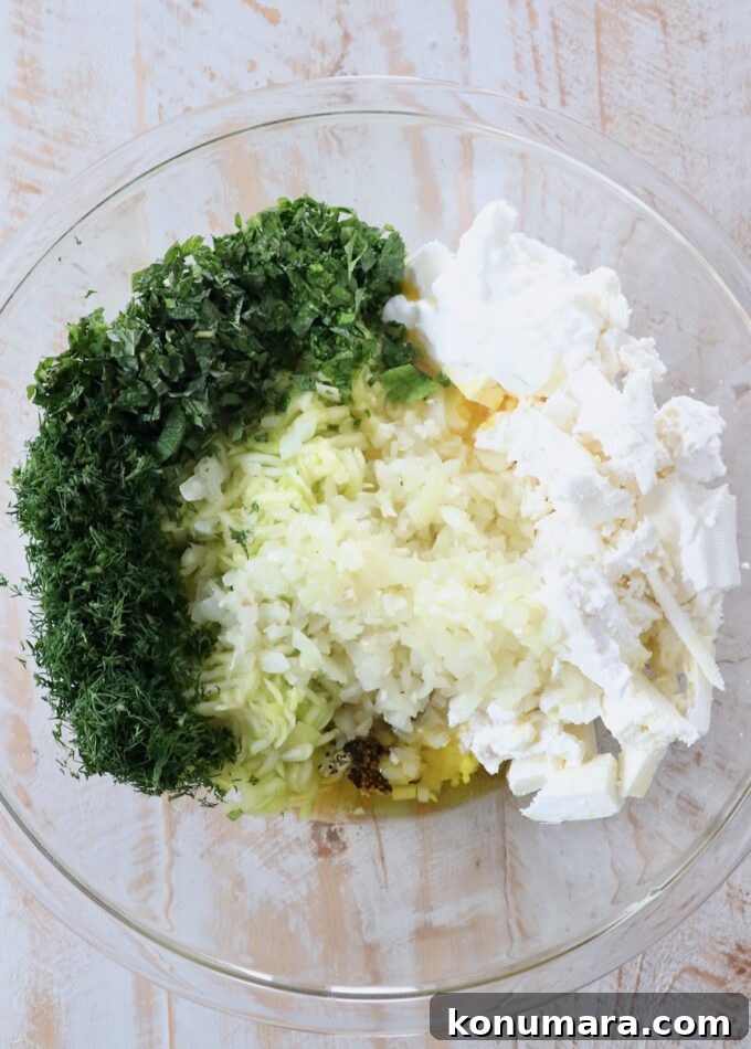 ingredients for zucchini pie filling in glass bowl