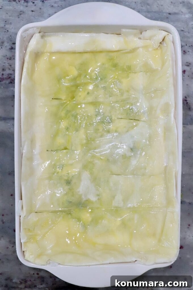 unbaked zucchini pie with phyllo crust in rectangle baking dish