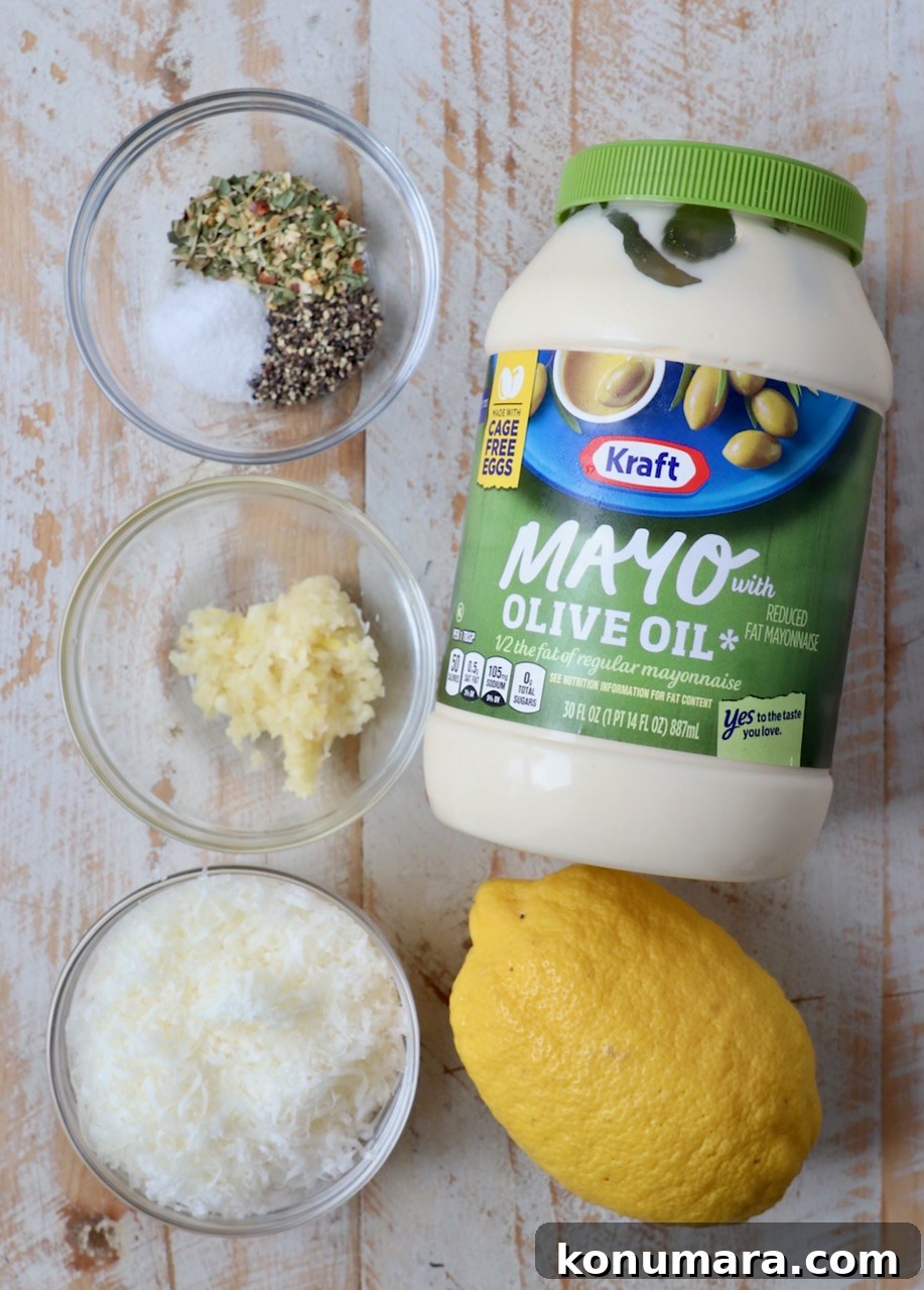 Creamy Garlic Parmesan Sauce Recipe 5 ingredients for garlic parmesan sauce on white wood board