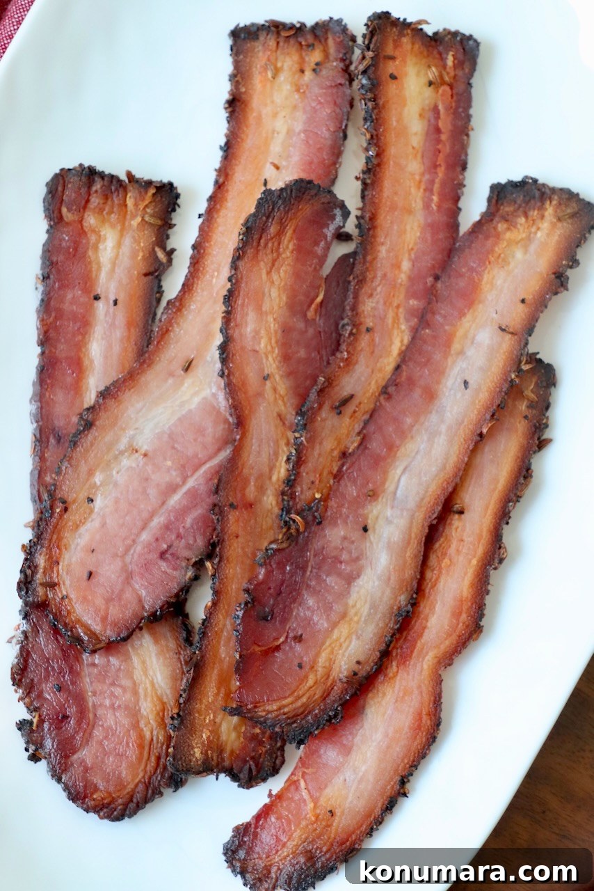 slices of cooked bacon on white plate