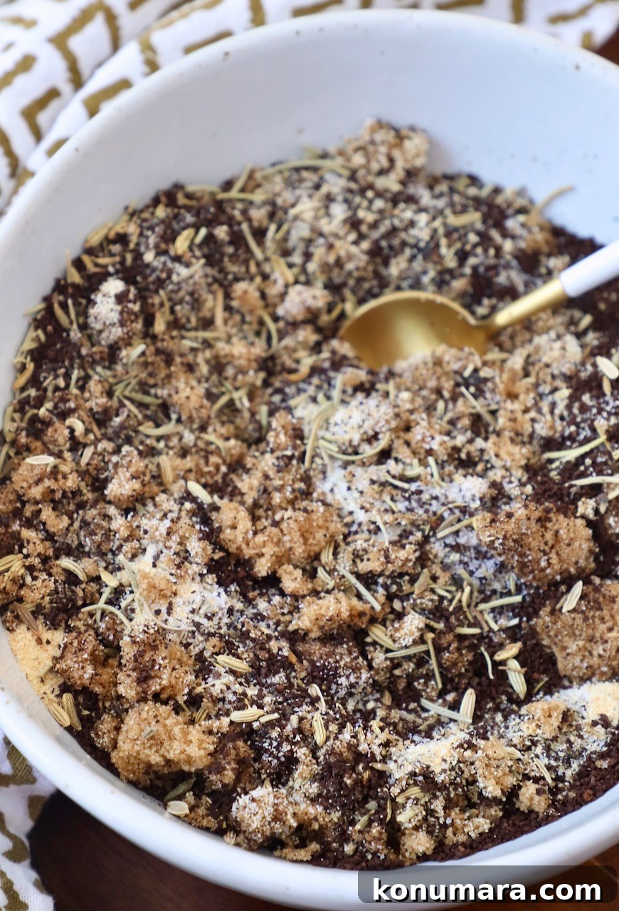 ground coffee mixed with brown sugar and dried herbs in bowl with spoon