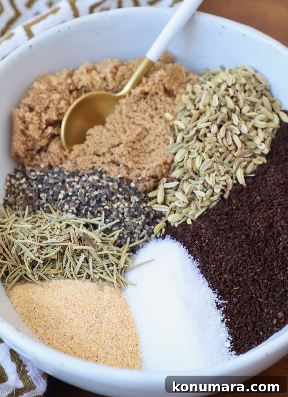 coffee grounds, brown sugar, herbs and spices separated in bowl with a small spoon