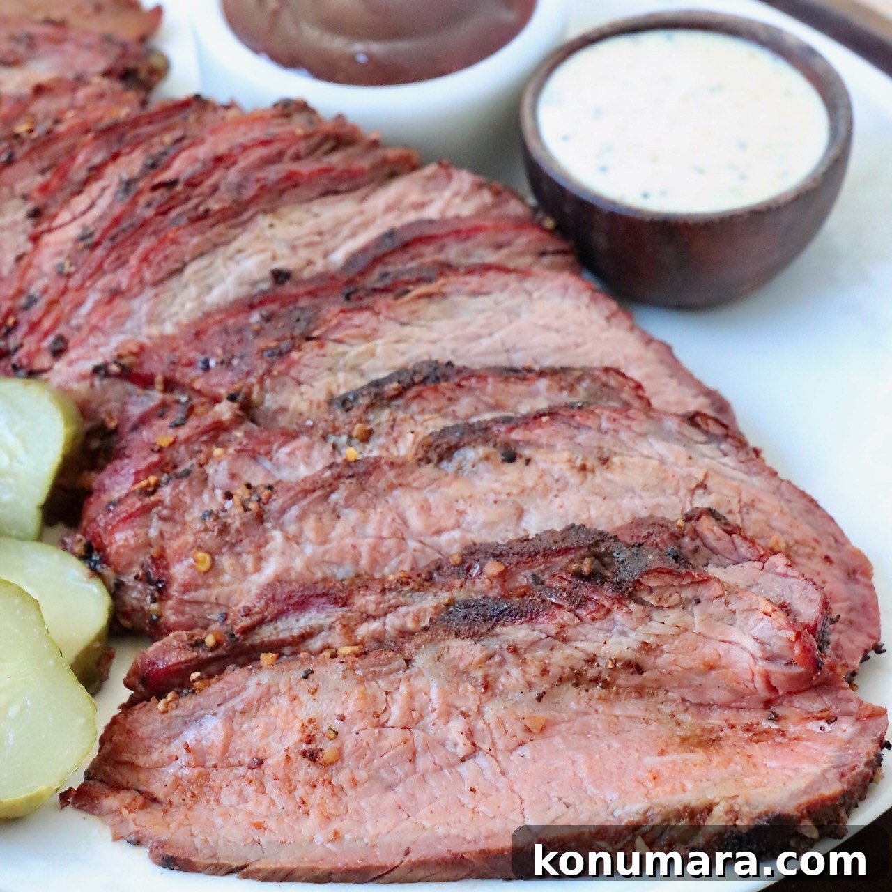 Creamy Alabama White BBQ Sauce Recipe 5 sliced smoked tri tip on plate with bowls of bbq sauce