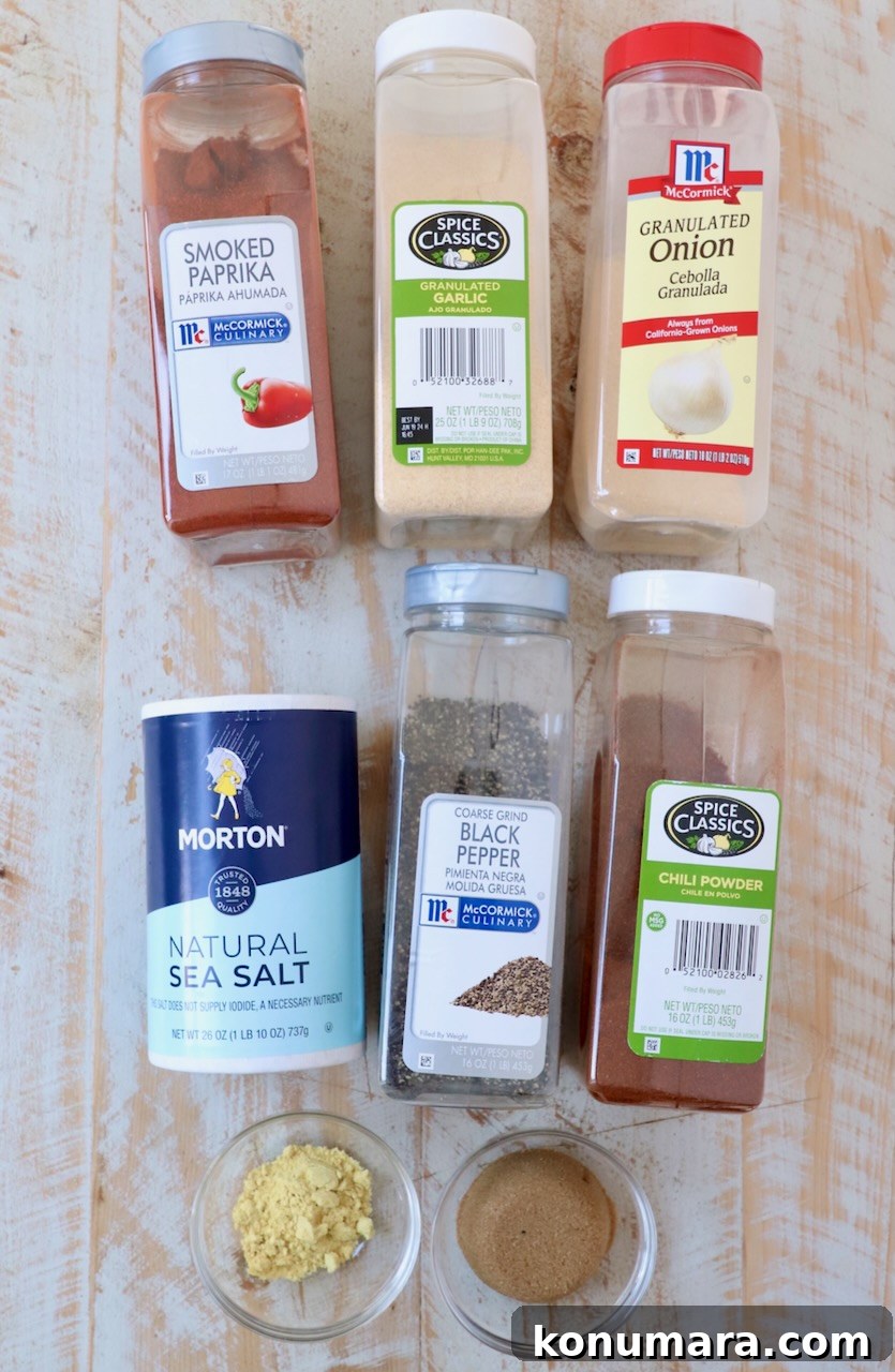 ingredients for bbq seasoning on white wood board