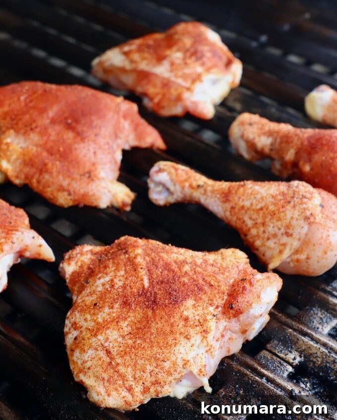 Juicy BBQ Chicken Recipe with Smoky Barbecue Sauce 5 seasoned pieces of chicken on grill