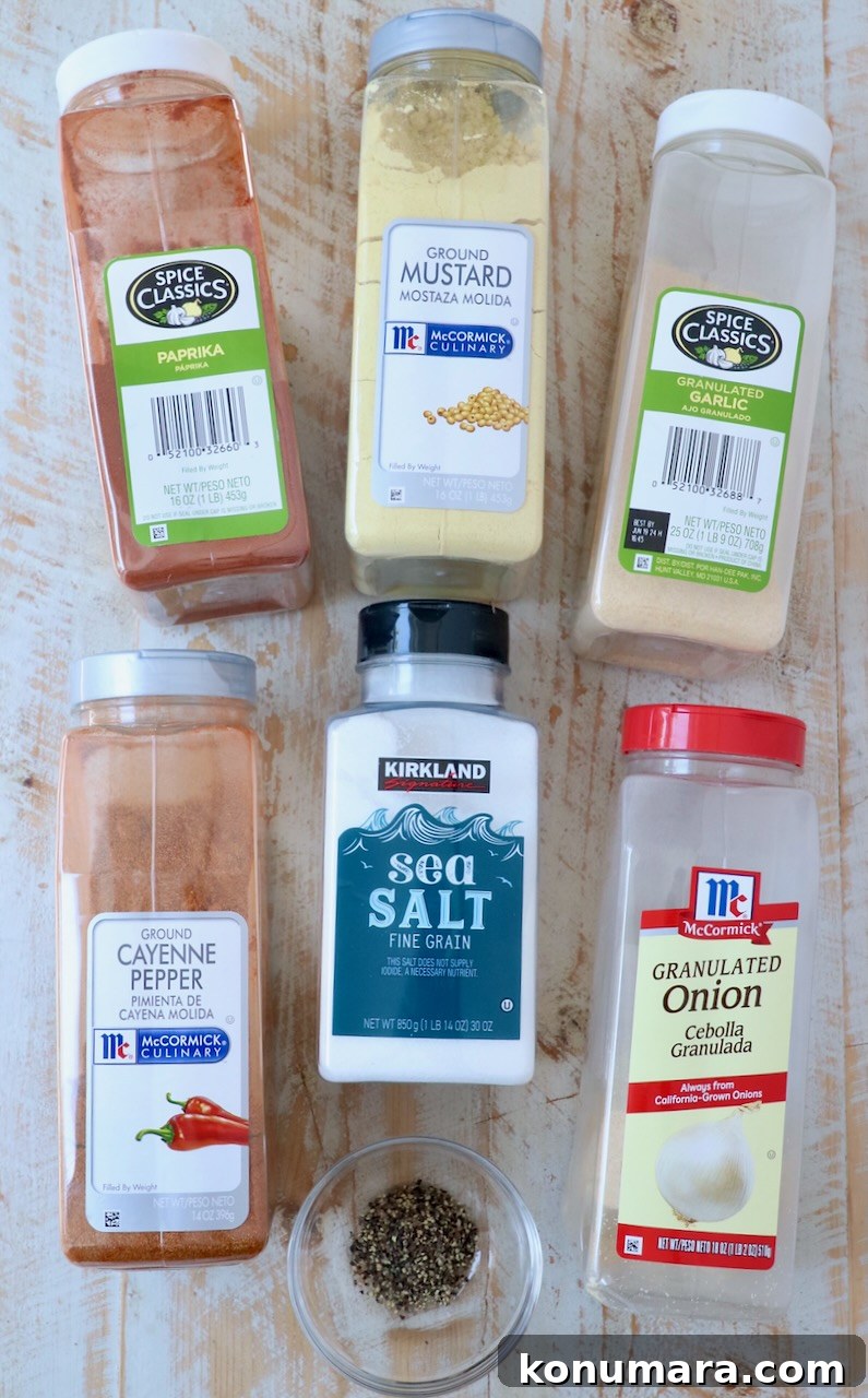 spices in containers on white wood board