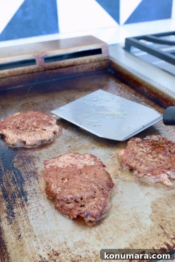 smashed burgers on griddle