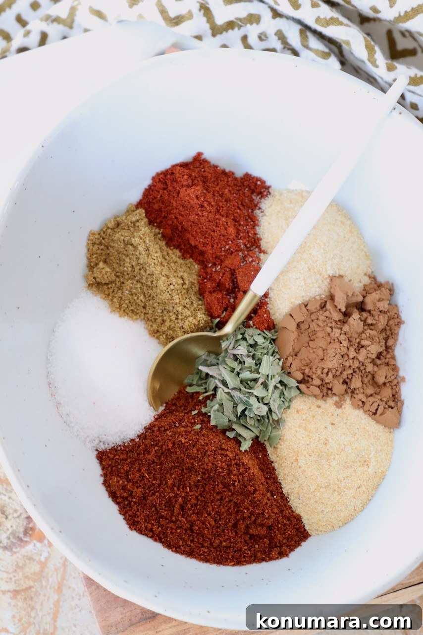 spices separated in a bowl with a spoon