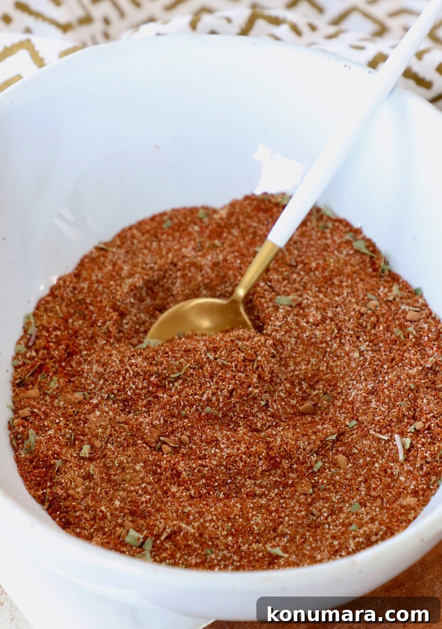 enchilada seasoning in bowl with spoon