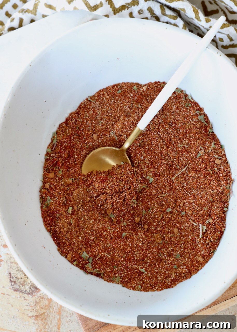 enchilada seasoning in bowl with spoon