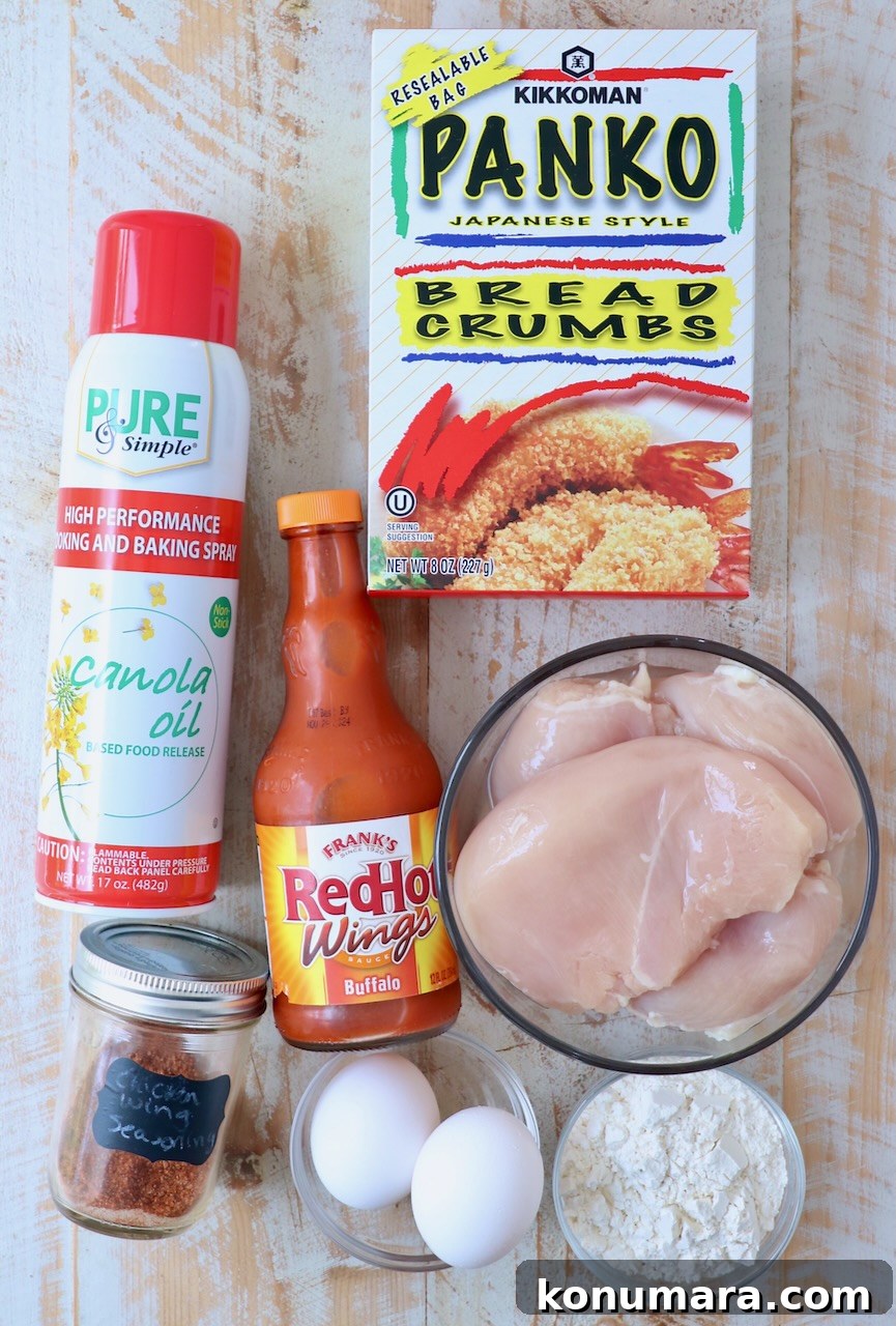 ingredients for boneless wings on white wood board