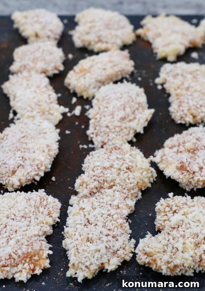 pieces of breaded chicken on cutting board