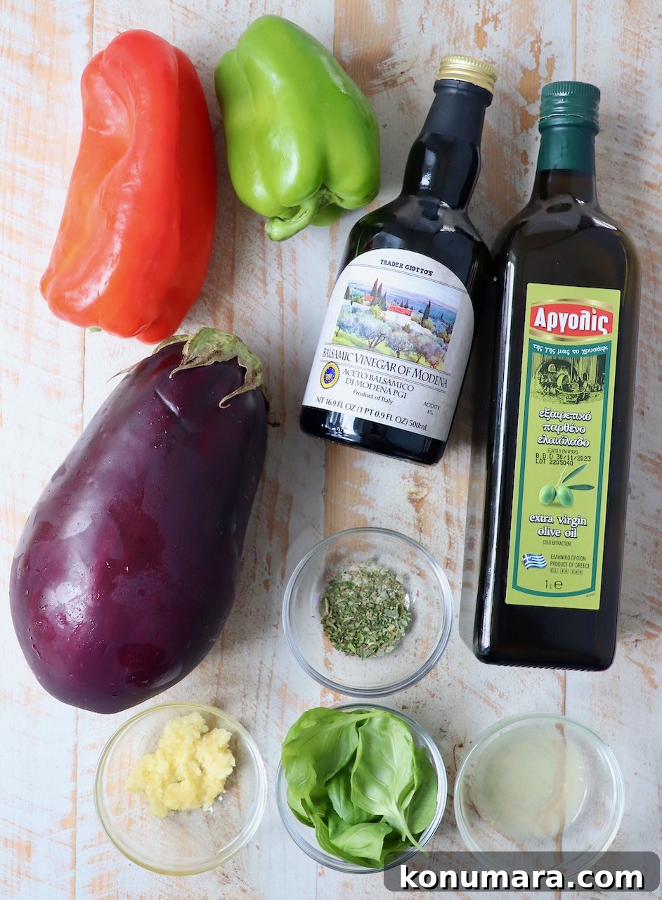 Smoky Grilled Eggplant Salad with Lemon and Herbs 3 ingredients for eggplant salad on white wood board
