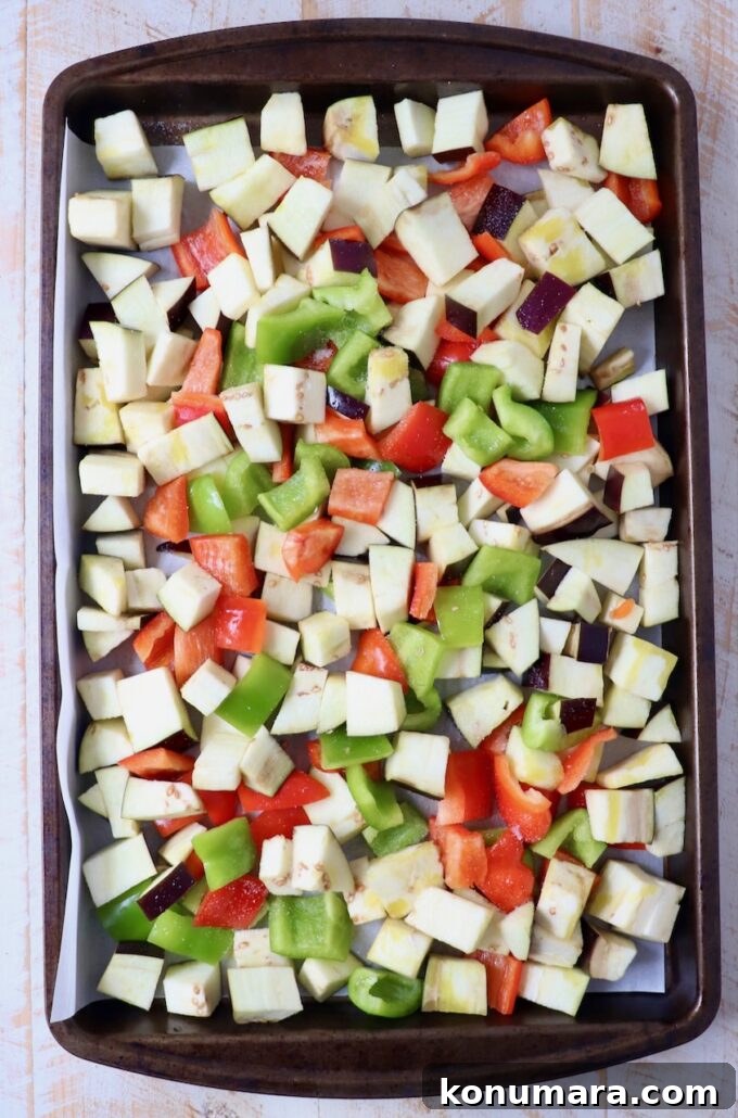 Smoky Grilled Eggplant Salad with Lemon and Herbs 4 diced eggplant and bell peppers on baking sheet