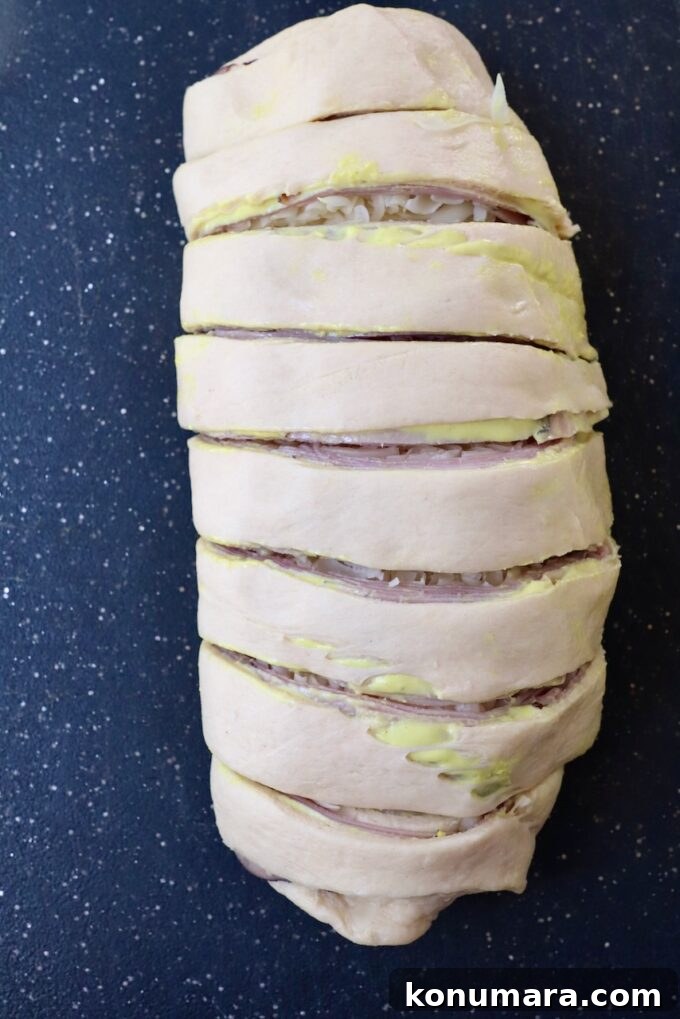 Crescent roll dough rolled up, sliced into one-inch sections