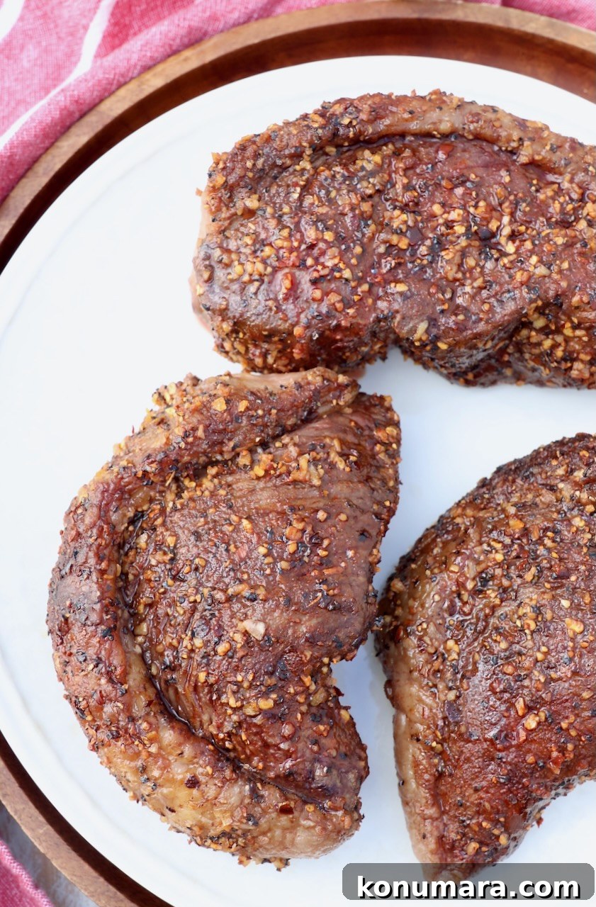 Rotisserie Picanha Recipe: Juicy Brazilian Rump Cap on the Spit 15 cooked picanha steaks on plate