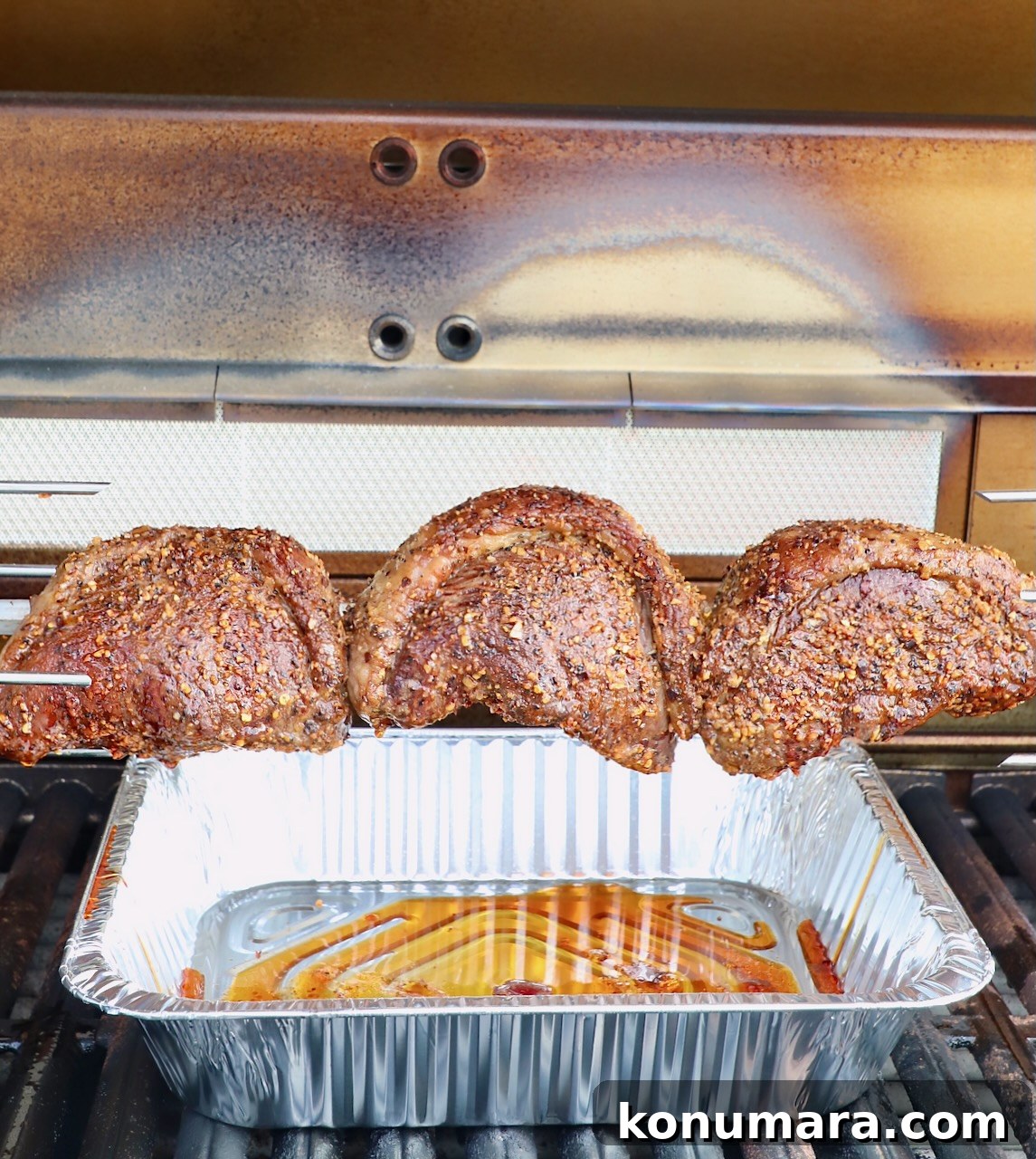 Rotisserie Picanha Recipe: Juicy Brazilian Rump Cap on the Spit 16 picanha steaks on rotisserie rod in grill