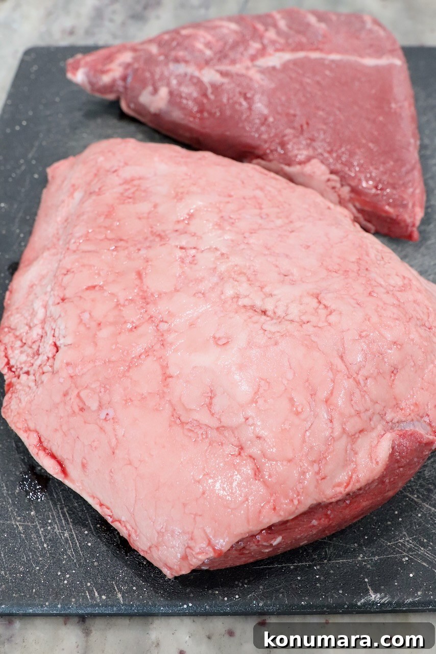 Rotisserie Picanha Recipe: Juicy Brazilian Rump Cap on the Spit 3 sirloin cap steaks on cutting board