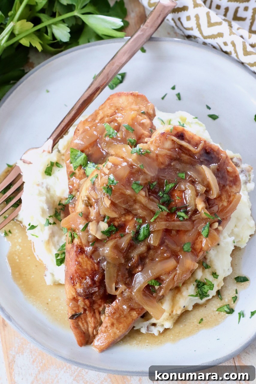 cooked chicken breast on plate with mashed potatoes