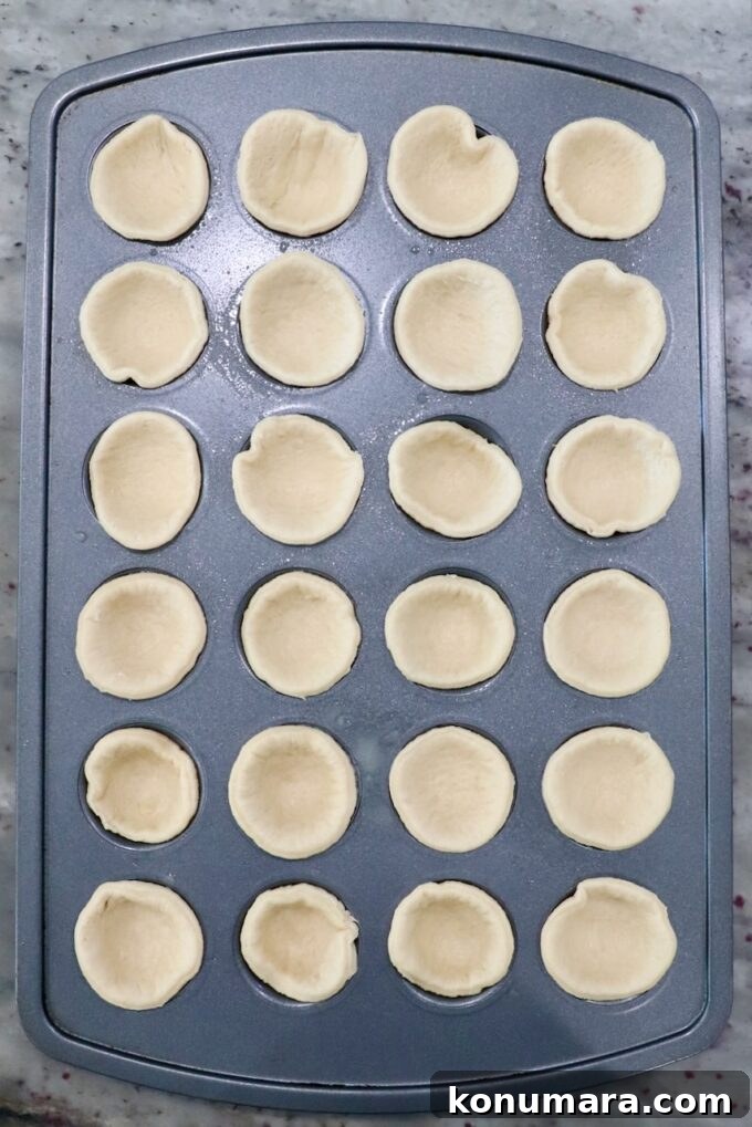 Mini Apple Pie Recipe: Cinnamon Hand Pies 5 crescent roll dough rounds in mini muffin tin