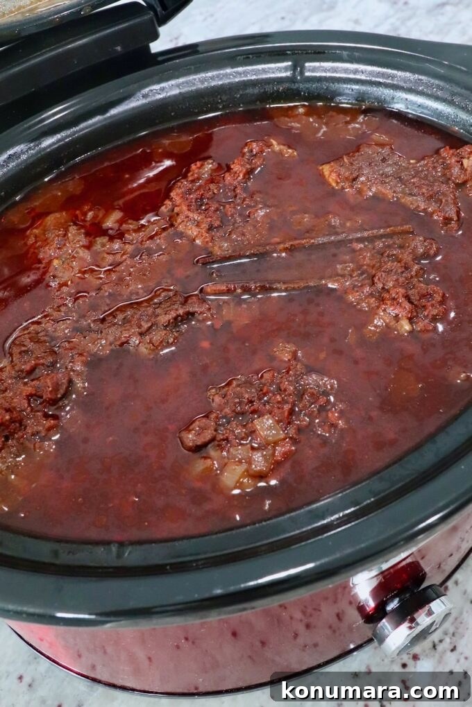 cooked birria in a slow cooker
