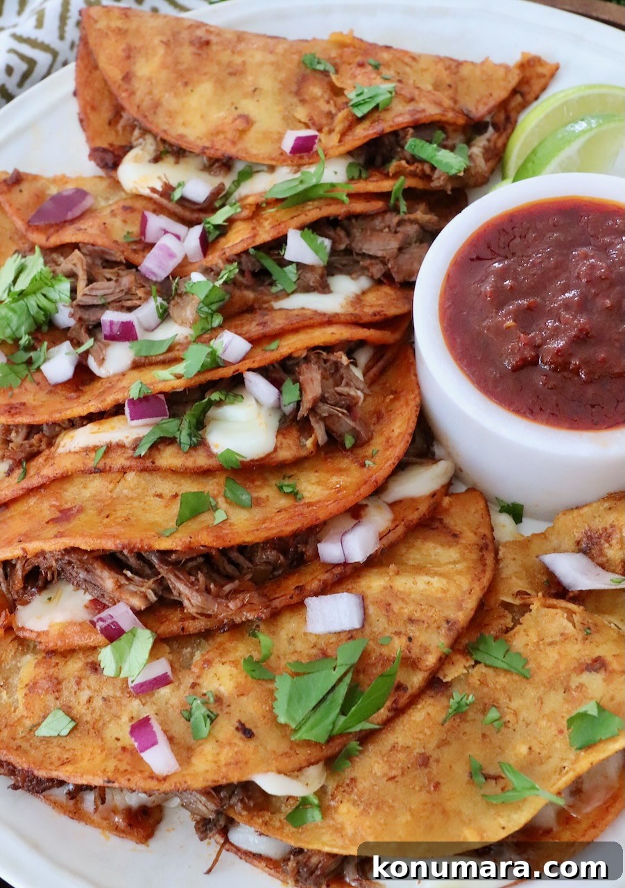 Quesabirria Recipe: Crispy Cheesy Birria Tacos 7 quesabirria tacos on plate