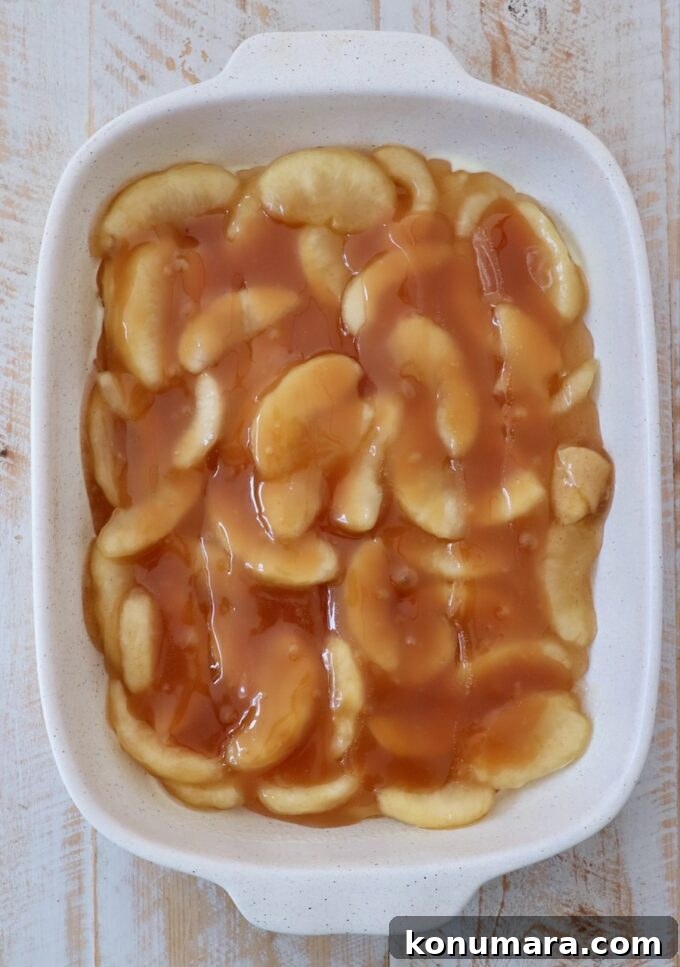 One-Pan Caramel Apple Dump Cake Recipe 4 apple pie filling and caramel sauce in baking dish