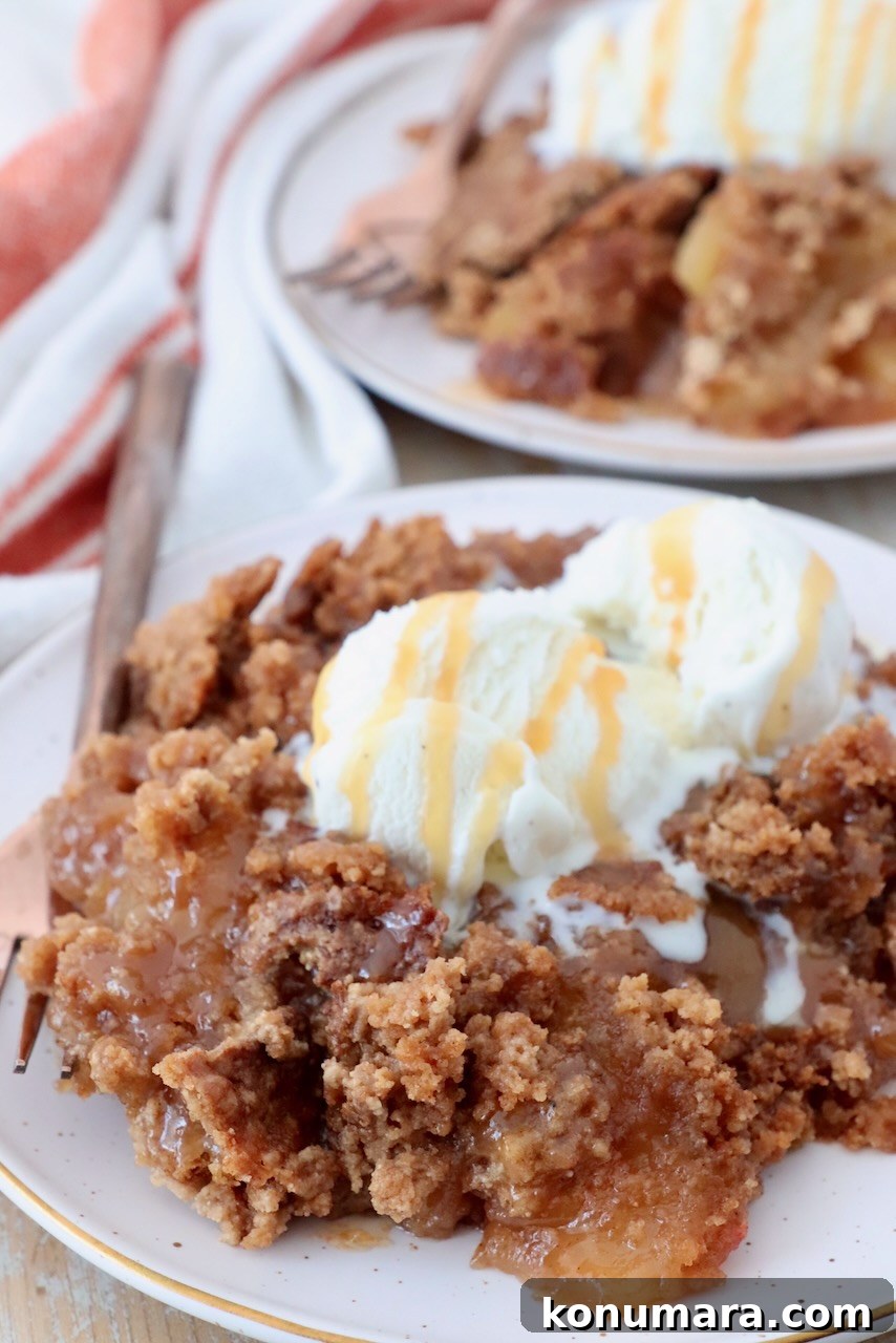 One-Pan Caramel Apple Dump Cake Recipe 9 caramel apple dump cake on plate with ice cream