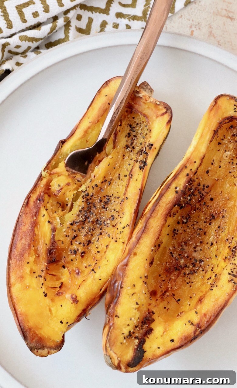 How to Cook Delicata Squash: Roast, Bake and Saute 11 cooked delicata squash cut in half on plate with fork