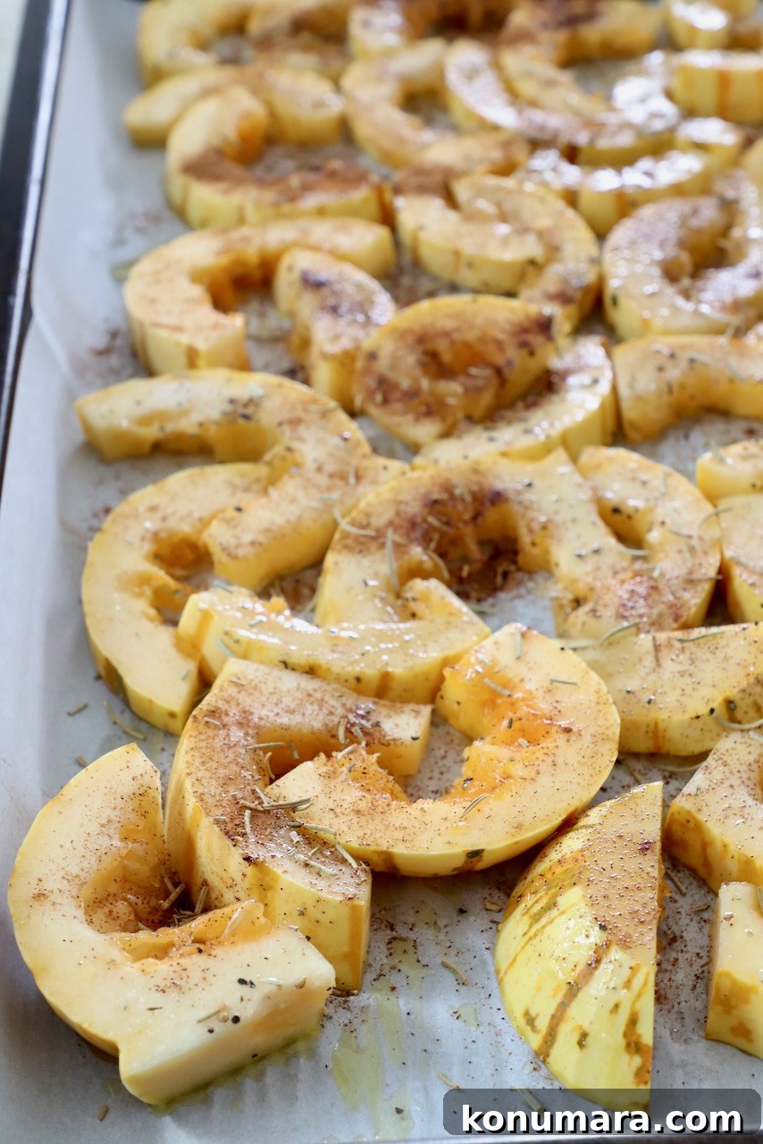 Roasted Delicata Squash Salad with Arugula and Feta 4 sliced seasoned delicata squash on baking sheet