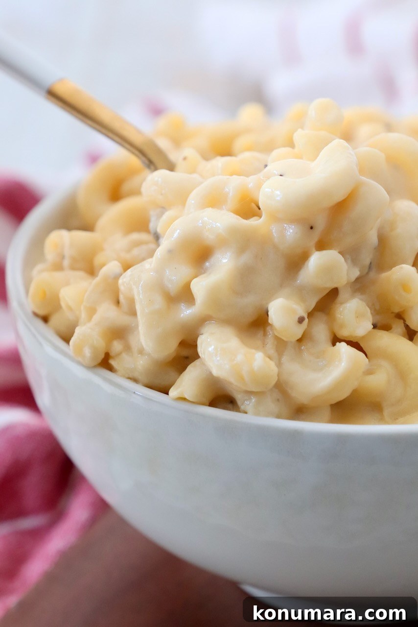 Creamy Homemade Mac and Cheese Recipe 9 mac and cheese in bowl with spoon