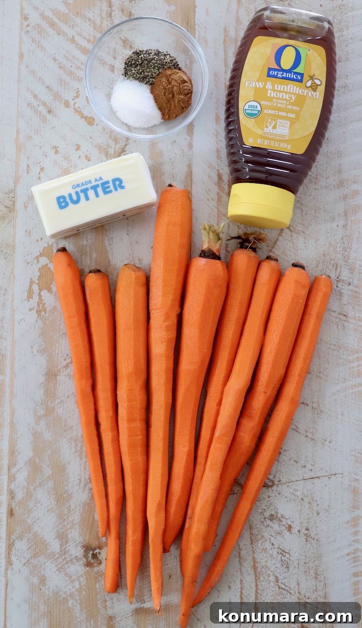 Honey-Glazed Carrots with Thyme and Garlic 3 honey glazed carrot ingredients on white wood board