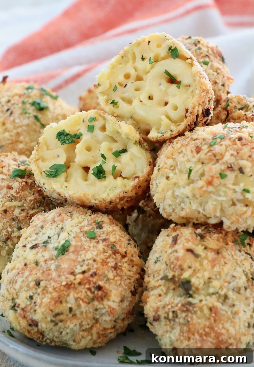 mac and cheese balls stacked up on a plate