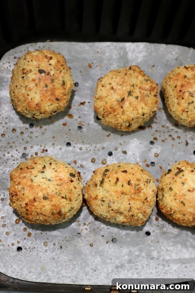 cooked mac and cheese bites in air fryer basket